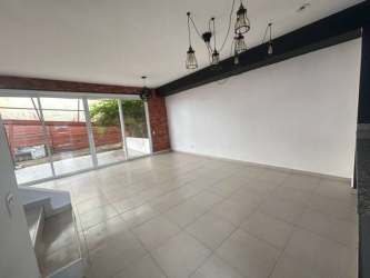 Living room with large sliding glass doors, tiled floors, bright lighting PH Residencial La Campiña Arraiján Panama