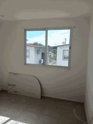 Minimalist empty room with white walls, large window PH Residencial La Campiña Villas de Arraiján Panama