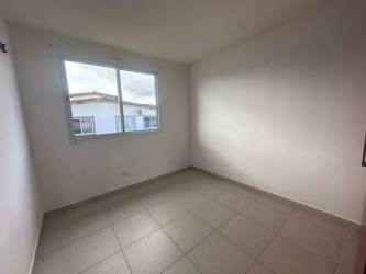 Empty secondary bedroom with large window, white walls, tile flooring PH Residencial La Campiña Arraiján Panama