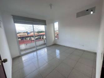 Bedroom with large sliding glass door, tiled floors, bright light PH Residencial La Campiña Villas de Arraiján Panama