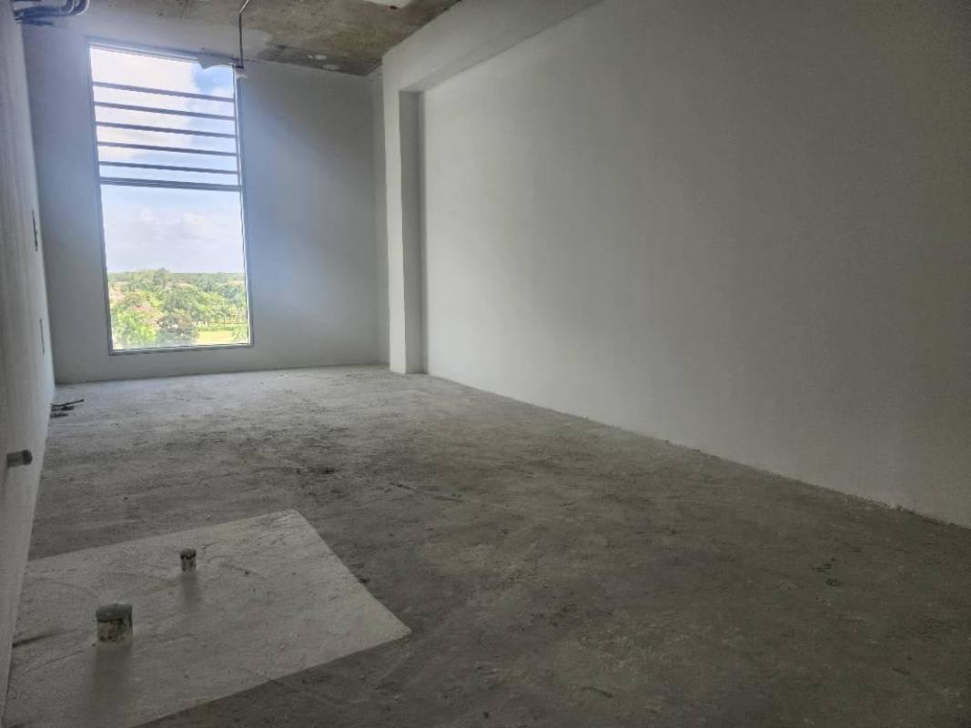 Modern lobby atrium at Town Center Costa del Este Pacifica Salud with glass facade and natural light