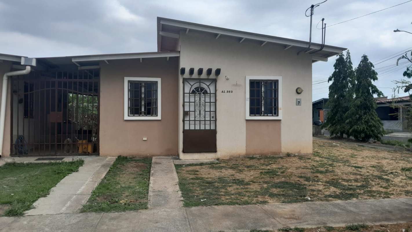 Front exterior of single story corner lot house with yard Los Álamos Pacora Panama