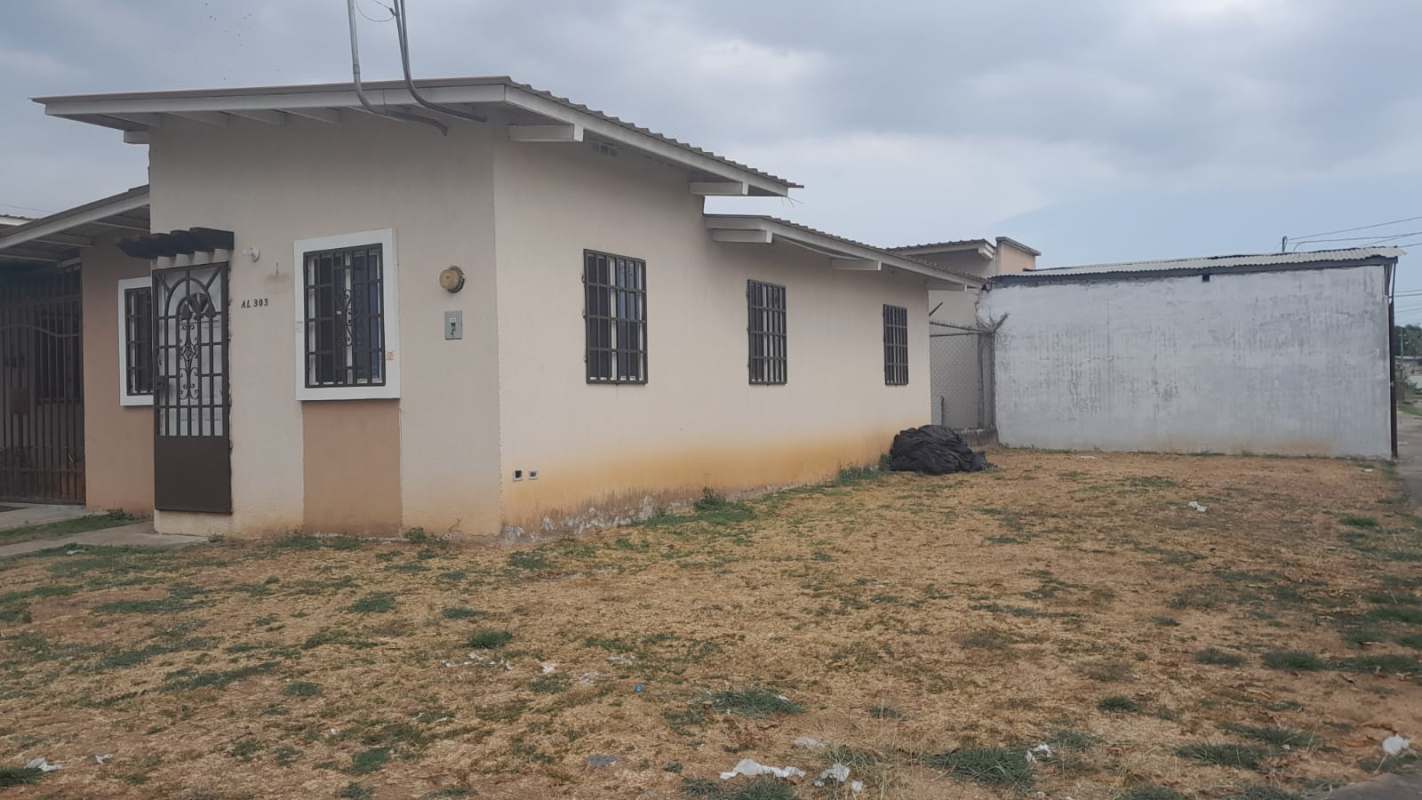 Large fenced yard and beige exterior corner lot house for sale Pacora Panama