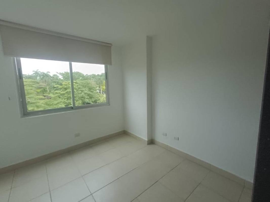 Bedroom with large window and green views in apartment for rent at Clayton Park Residences