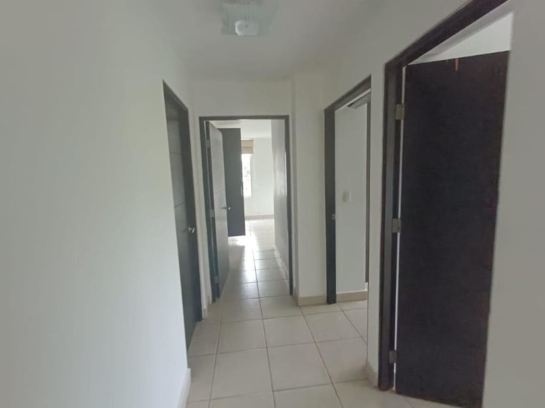 Bright hallway with tiled floors leading to bedrooms in apartment Clayton for rent