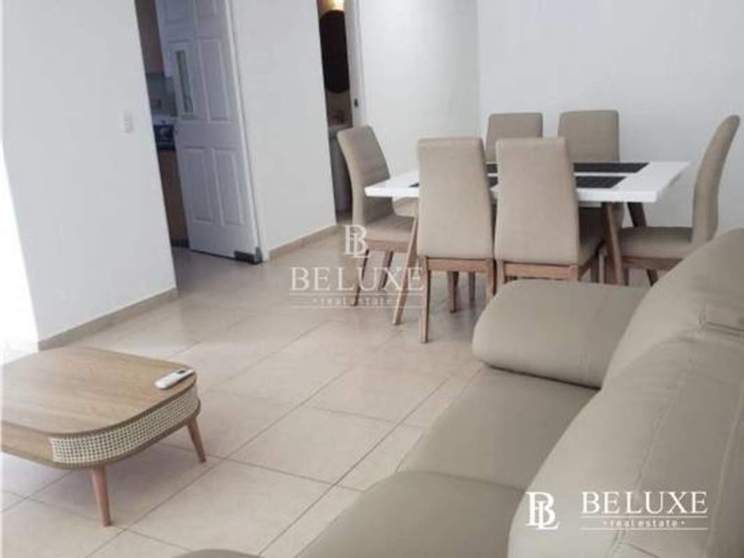 Bedroom with panoramic city view and large window at PH Sol del Este Costa del Este Panama