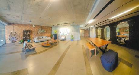 Open concept living and dining with big windows in PH Mosaic Panama Pacifico