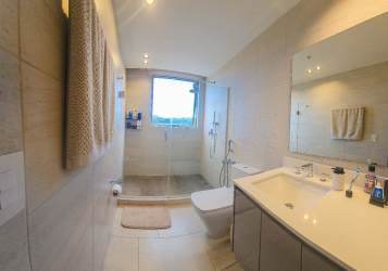 Bright bedroom with ensuite bathroom in PH Mosaic Panama Pacifico apartment