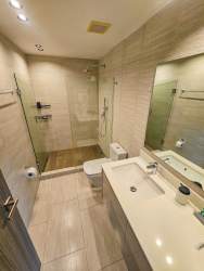 Covered balcony terrace overlooking gardens at PH Mosaic Panama Pacifico