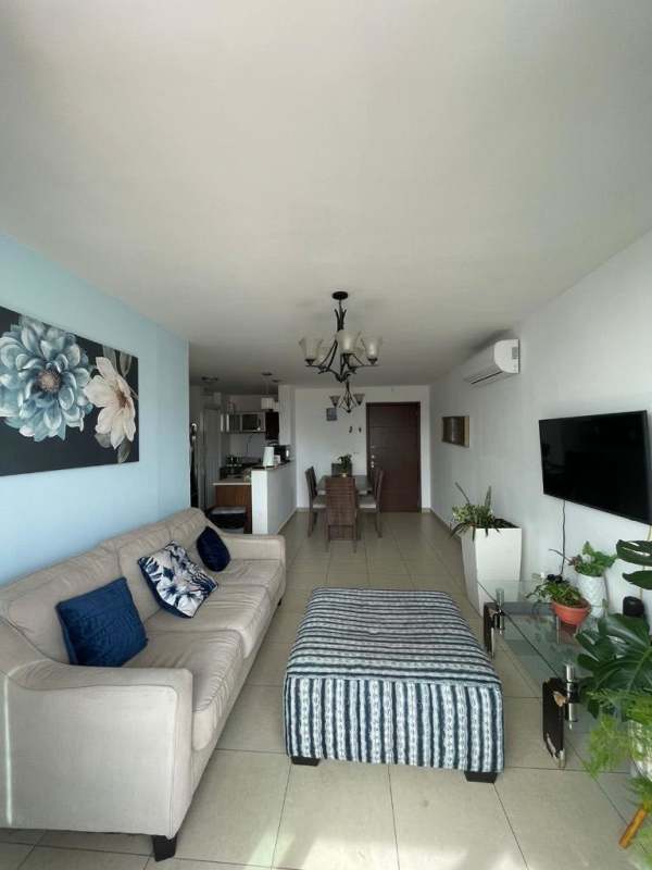 Master bedroom with split air conditioning, closet, and large window overlooking Panama City.