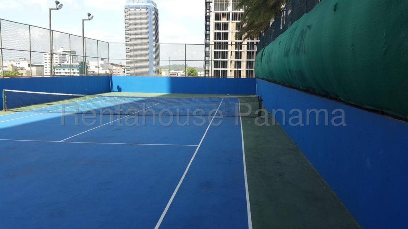 Rooftop tennis court at Rivage Tower Panama with panoramic city skyline view