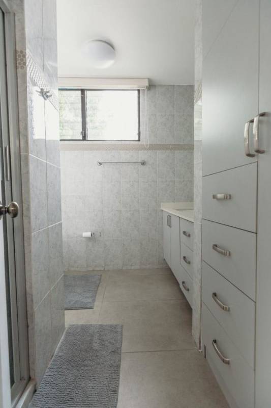 Kitchen with quartz countertops, stainless appliances in PH PRESTANZA Coco del Mar Panama City