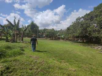Fenced flat residential land with grassy field and sky in Guadalupe La Chorrera Panama
