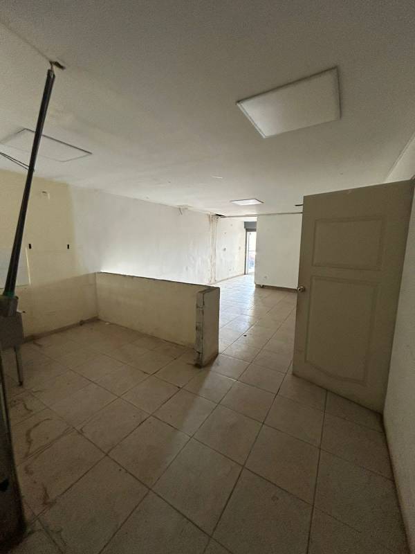 Interior open area with partition walls tiled for commercial rental Panama City