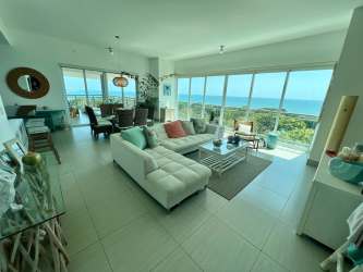 Coastal master bedroom with balcony access and panoramic sea view at PH Barcovento Panama