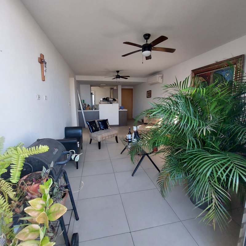 Bright living and dining room with ceramic tile floors, ceiling fans, modern decor in PH Sky Park El Carmen Panama
