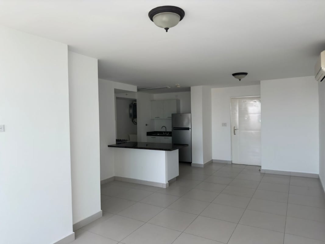 Spacious living room with large windows, balcony access, marble floors in PH Tee One San Francisco