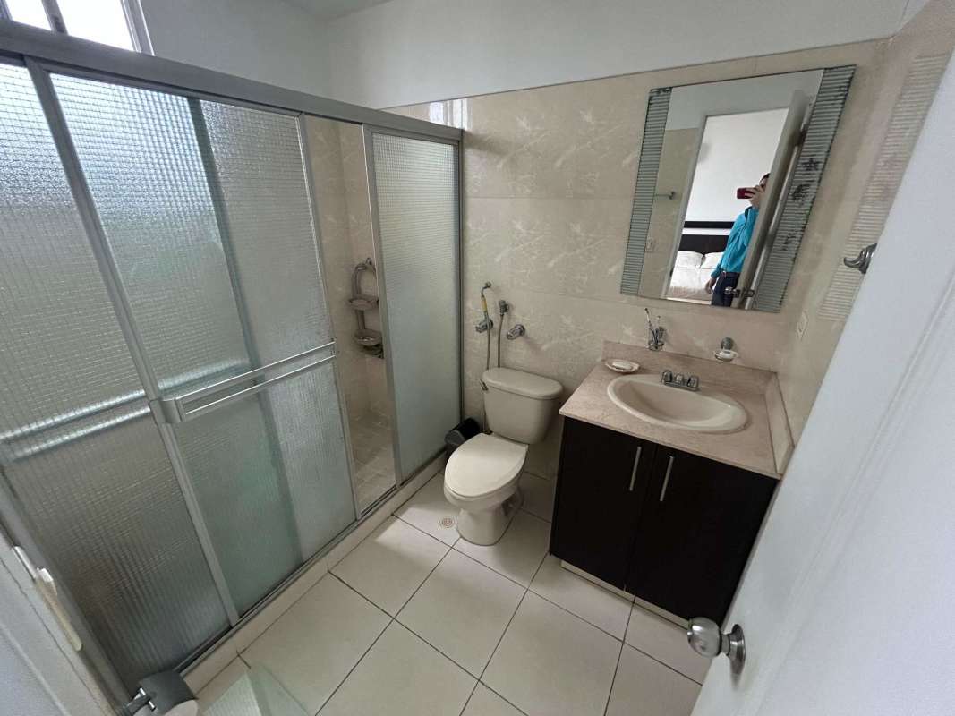 Modern resident gym with punching bag, weights and mirrors in PH San Francisco Park Panama