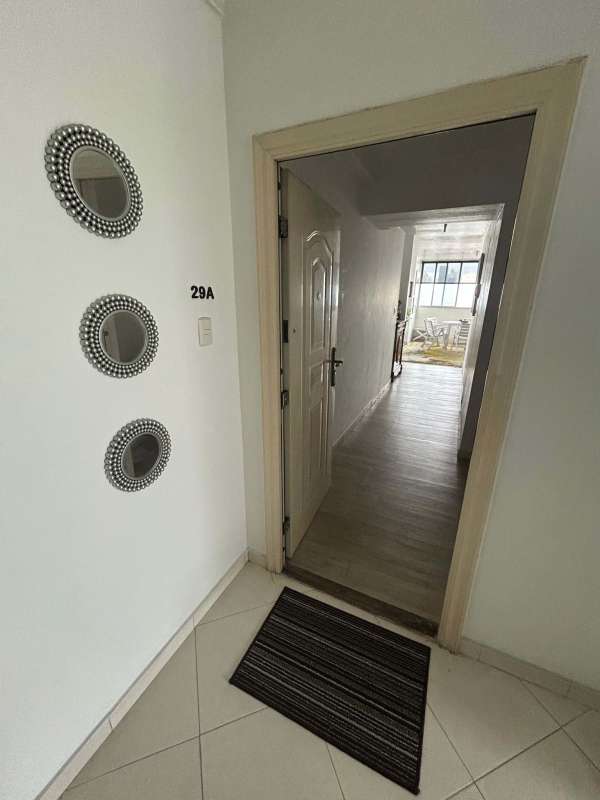 Modern kitchen with granite countertops, beige cabinets and appliances at PH San Francisco Park Panama City