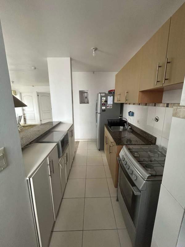 Bedroom with built-in closet, AC and city skyline view in apartment PH San Francisco Park Panama