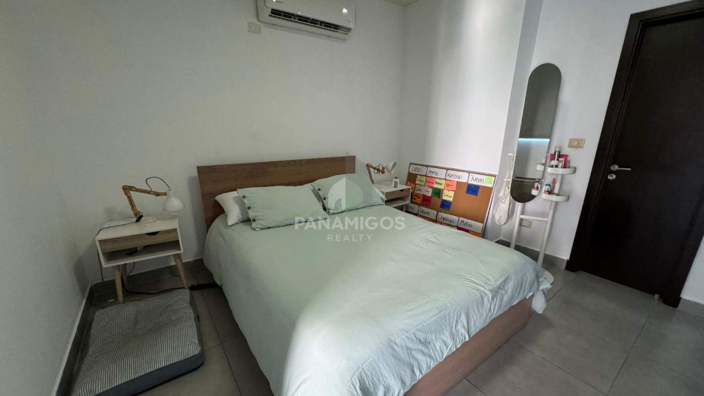 Spacious bedroom with large windows and city skyline view in PH Harmony on Avenida Balboa Panama City