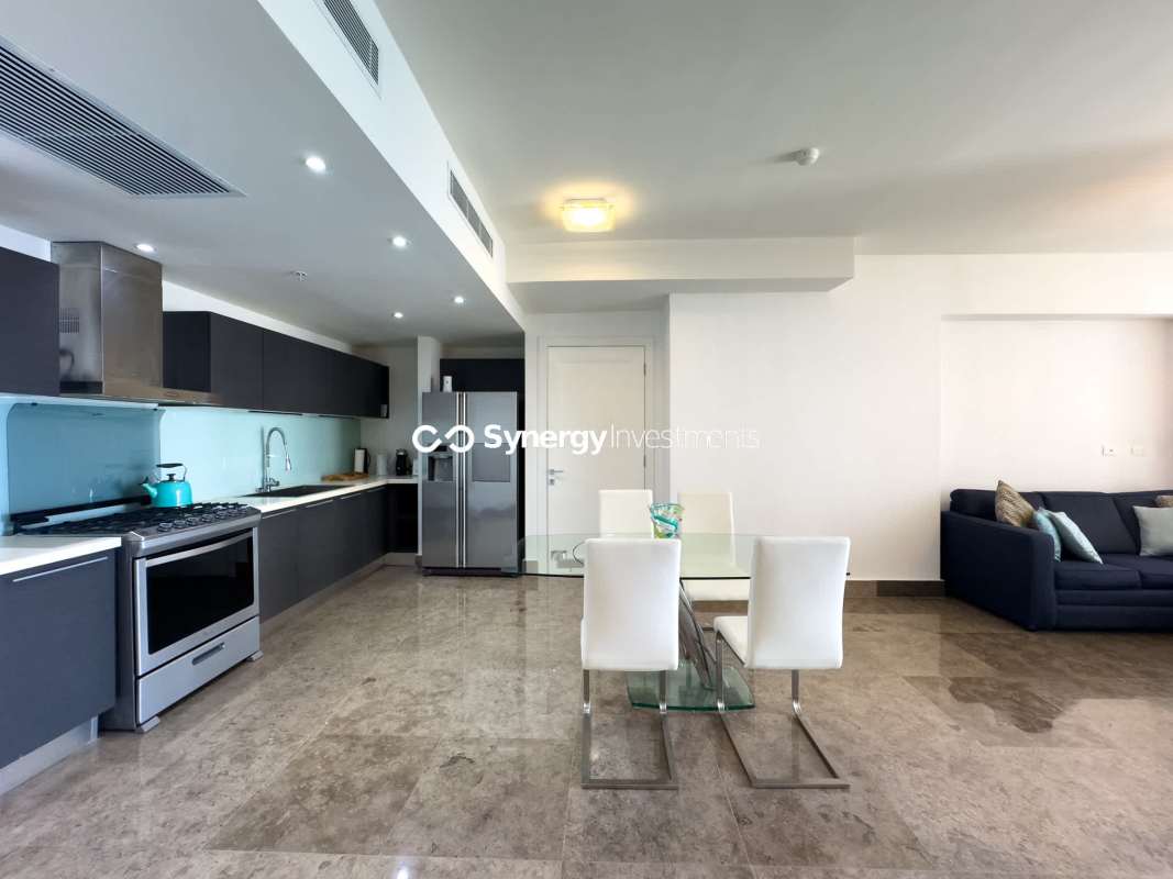 Modern open-plan kitchen with marble floors in Yoo Panama Avenida Balboa