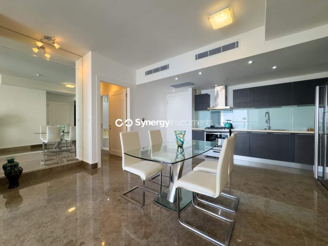 Bright living dining area with marble flooring in Yoo Panama