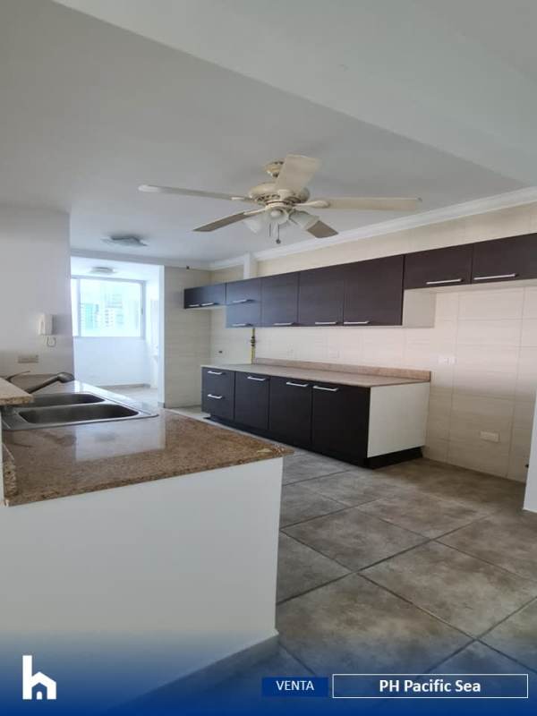 Large modern living and dining space with balcony and panoramic views in Punta Paitilla PH Pacific Sea Panama City