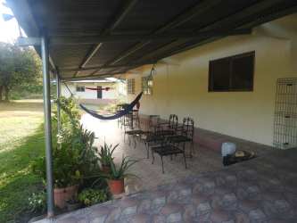 Covered outdoor veranda overlooking green countryside at estate near Penonomé Coclé
