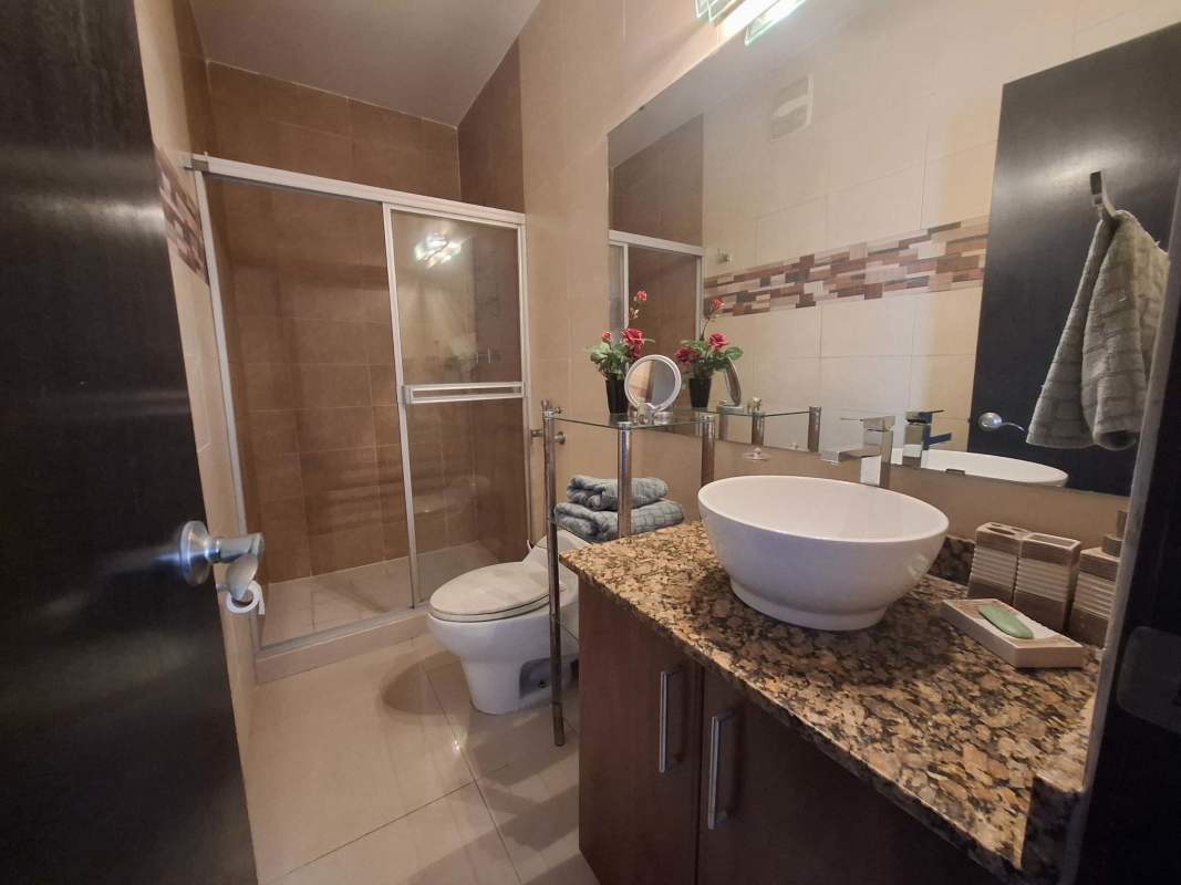 Modern bathroom, vessel sink, granite countertop, glass shower PH Renaissance Tower Obarrio