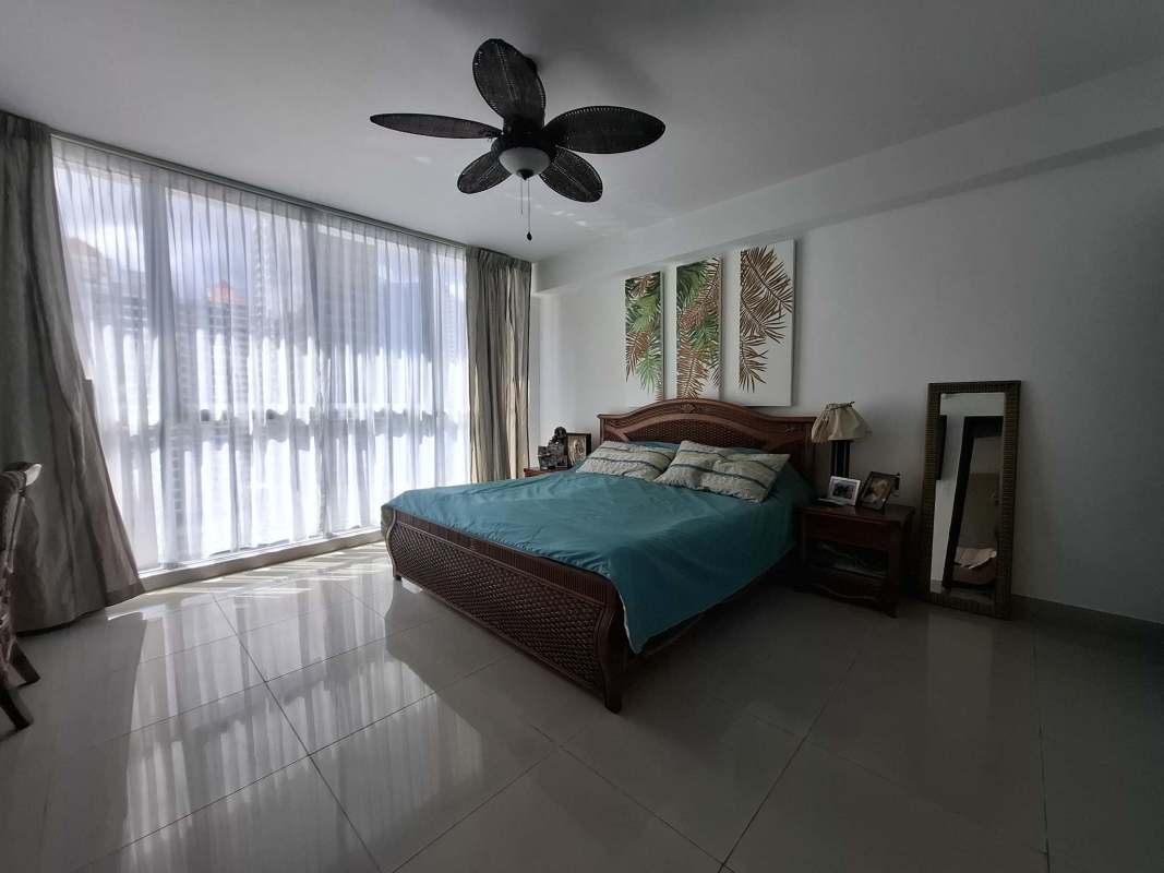 Closed kitchen, granite countertop, dark wood cabinets PH Renaissance Tower Obarrio Panama