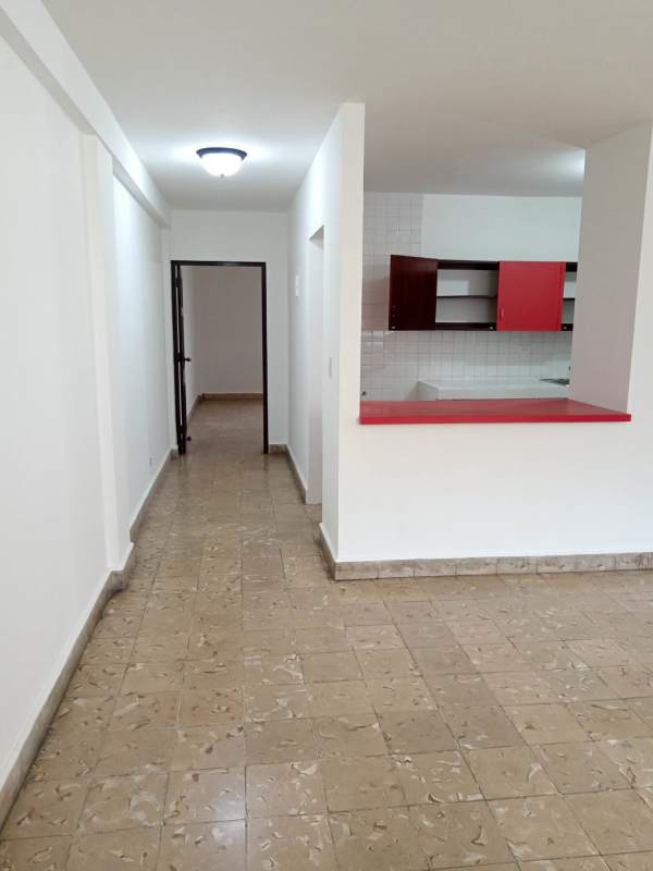 Interior hallway and red accented kitchen granite floor commercial mixed use Panama