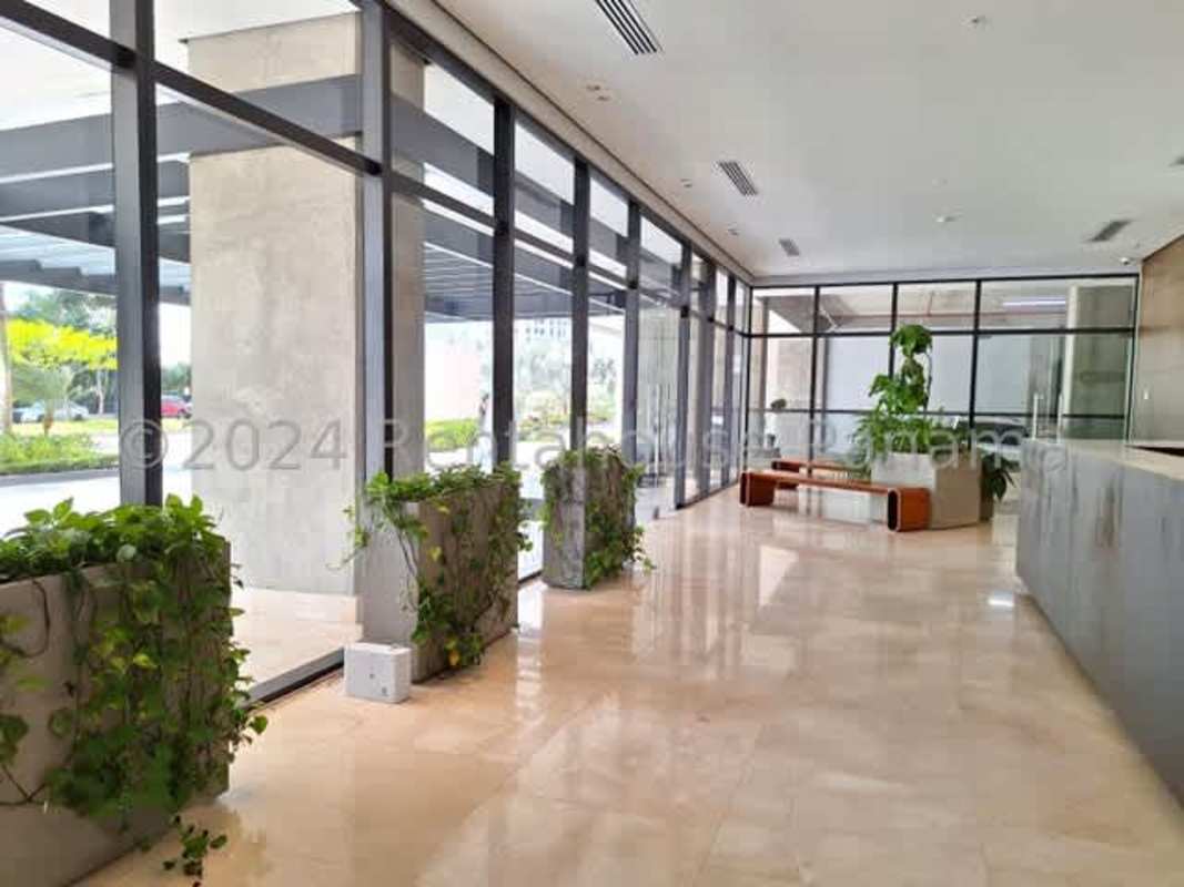 Modern lobby area with marble floors and floor-to-ceiling windows PH Santa Maria Panama