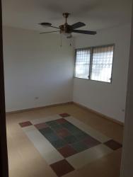 Bright bedroom with ceiling fan and security windows in El Farallón Rio Hato Panama