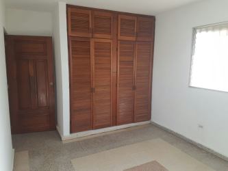 Bedroom traditional tile floor wooden closet in Panama house Coclé