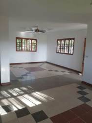 Bedroom with built-in closet, ceiling fan, tiled flooring in house near Playa Blanca Panama