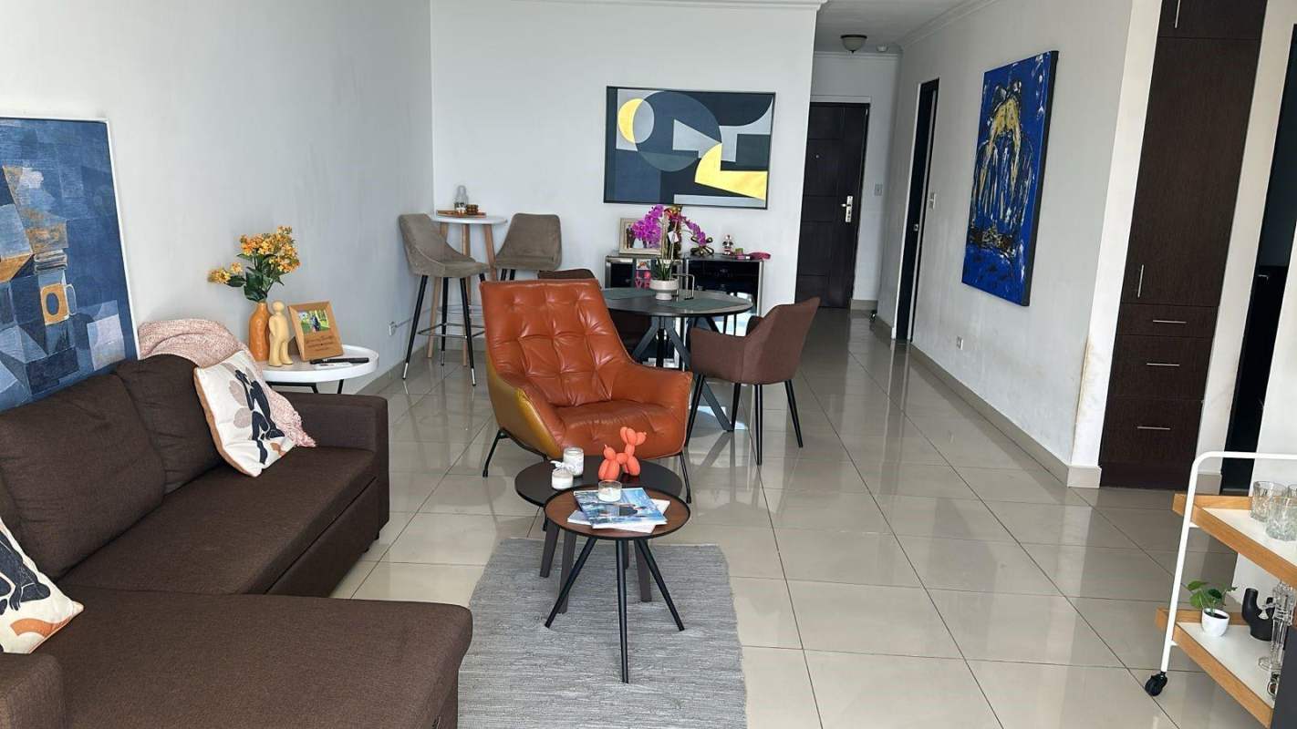 Spacious living dining area with colorful artwork and modern furniture PH Serenity San Francisco Panama