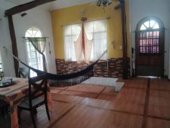 Outdoor patio with brick barbecue surrounded by garden in Penonomé Panama