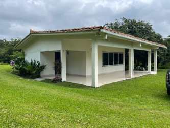Pasture and farmland with trees under cloudy sky in El Valle Cocle Panama
