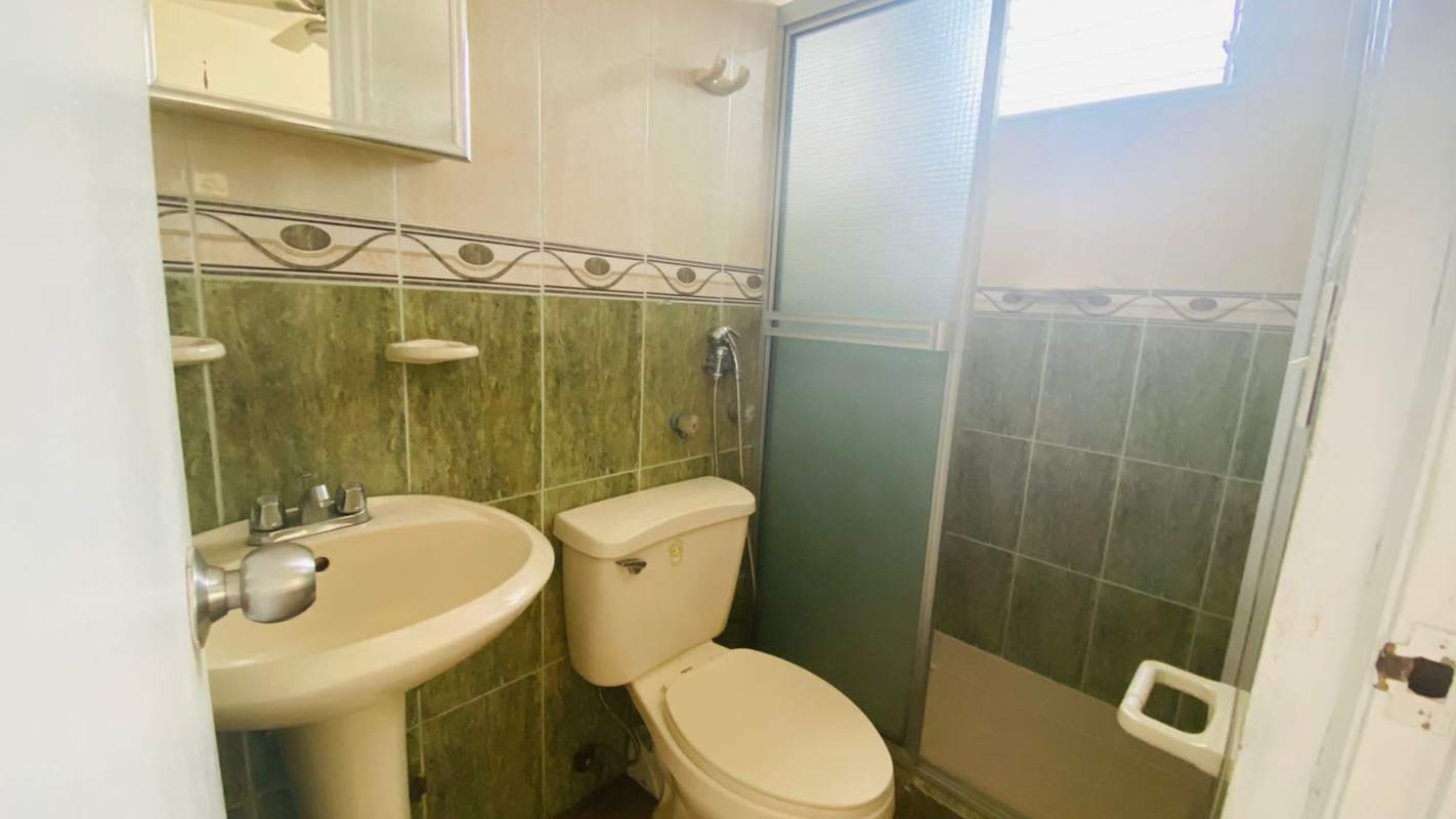 Bright living room with tiled floor, windows in PH Capri apartment Panama