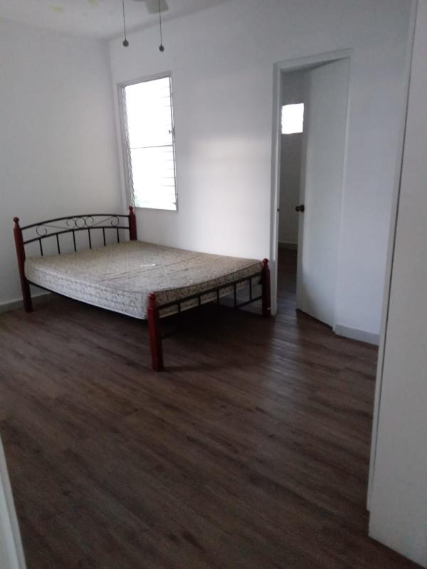 Bedroom with wood floors, natural light, ceiling fan, windows in PH Capri San Francisco
