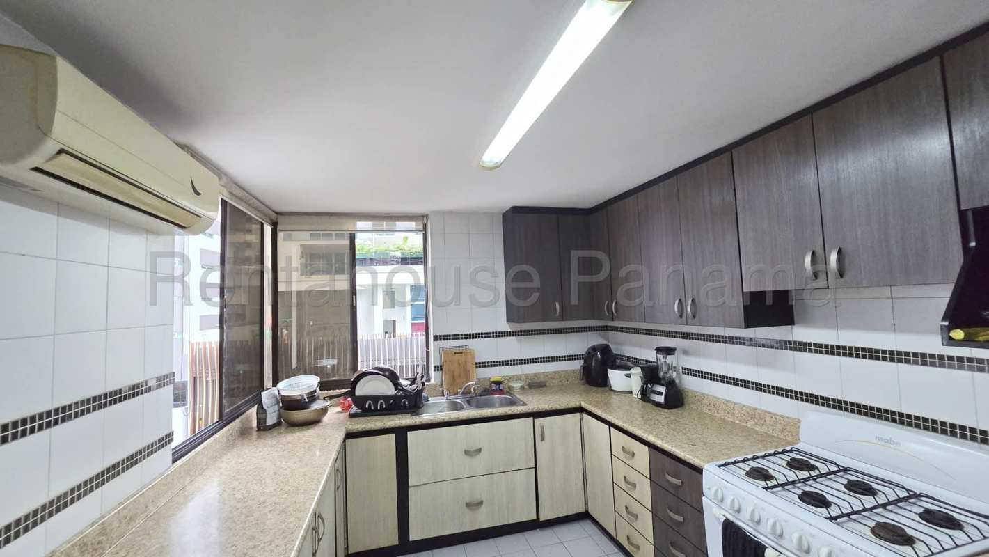 Outdoor swimming pool with city backdrop and sun deck at PH Vizcaya Punta Paitilla Panama City