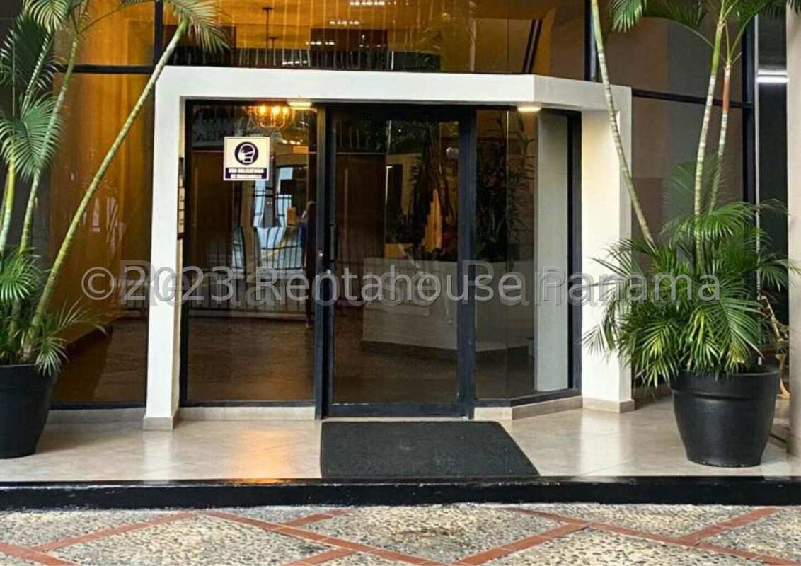 Bedroom with large window, closet, ceiling fan and AC at PH Vizcaya Paitilla Panama City