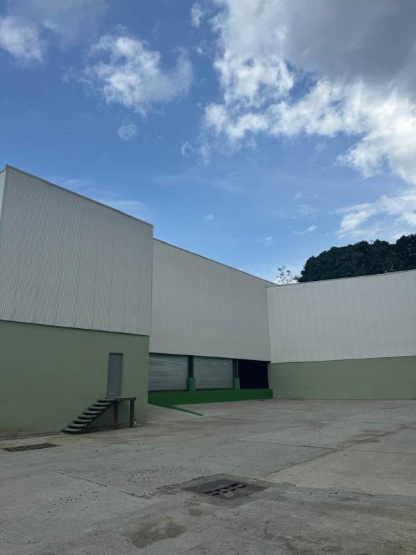 Large warehouse building with parking and loading zones at Las Mañanitas Industrial Park