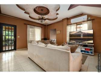 Living room with decorative ceiling design, sectional sofa, large windows and entertainment center Villa Venice El Terronal David Panama