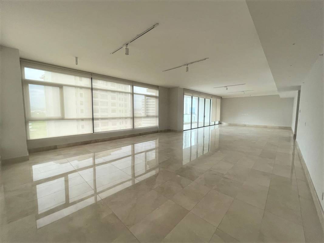 Large living area with panoramic windows and marble flooring in PH Albatros Santa María Panama