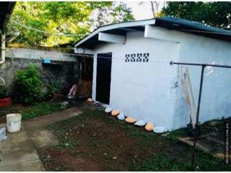 Small backyard shed garden space utility foreclosure house David Panama