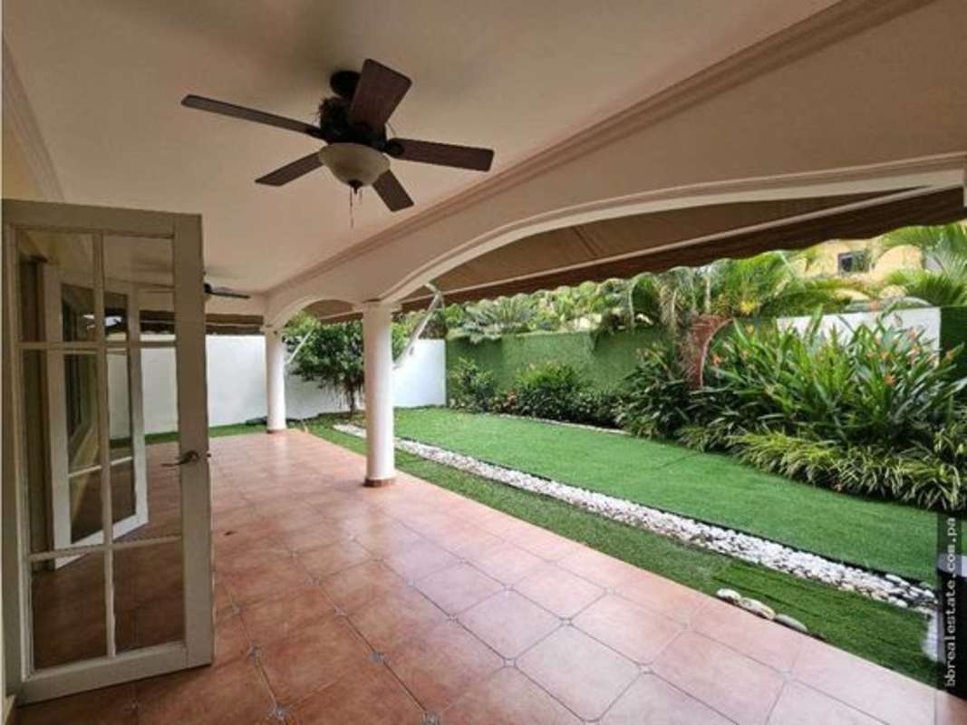 Bright living room with chandeliers and large windows in PH Palmeras del Este Costa del Este Panama
