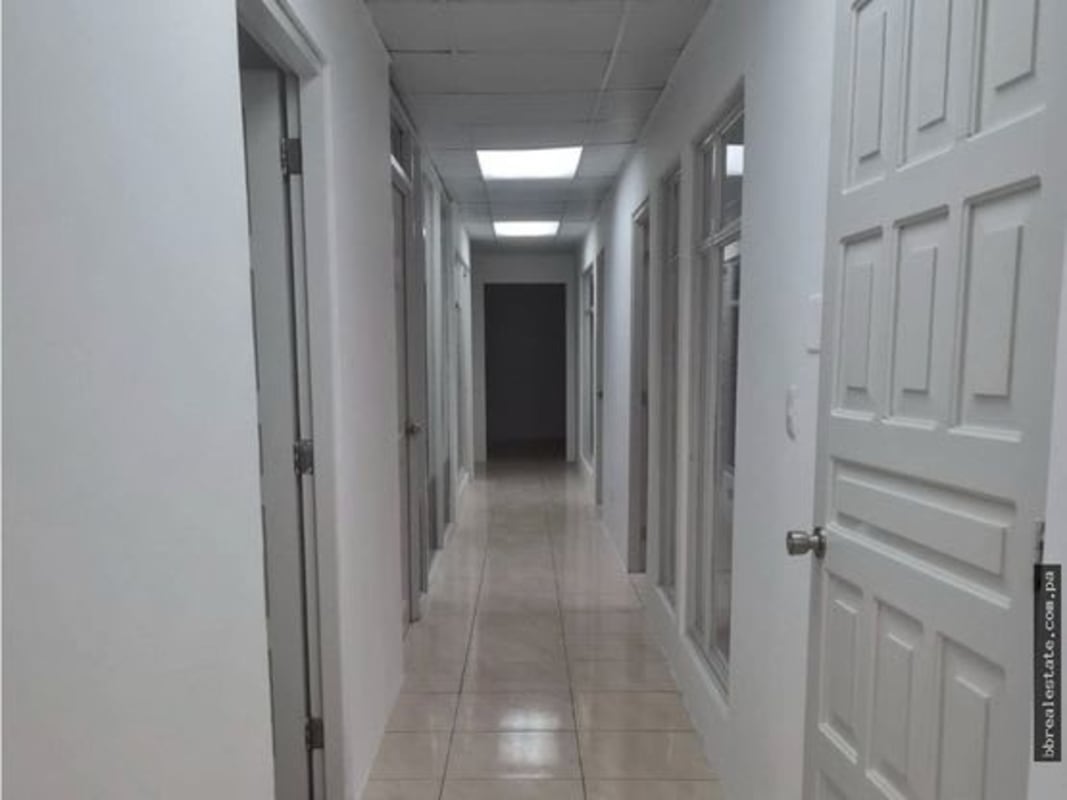 White hallway with interior glass doors in Obarrio business commercial office Panama City