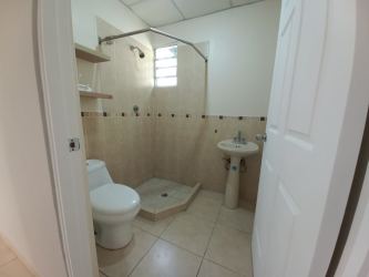 Spacious living room with ceramic tile flooring and split air conditioning in Arboledas La Chorrera rental house